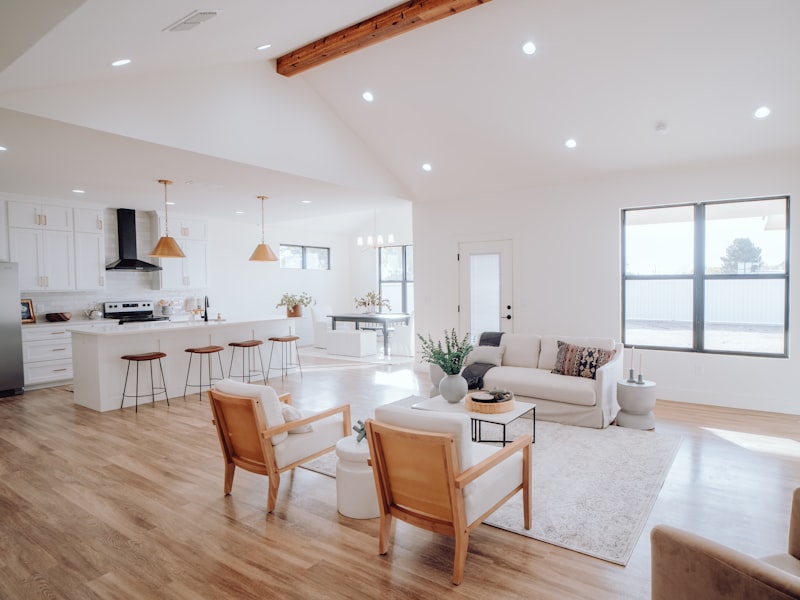 An open-plan kitchen and living area with clean countertops