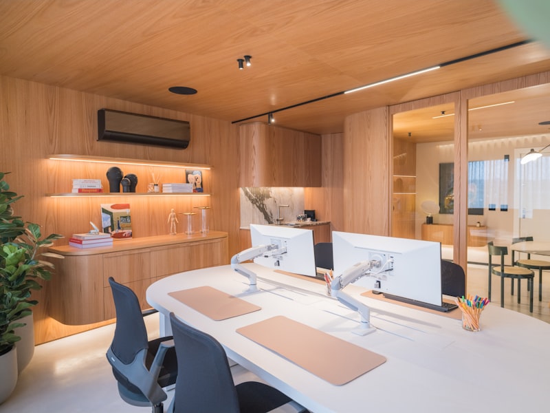 A small modern office desk with wooden accents